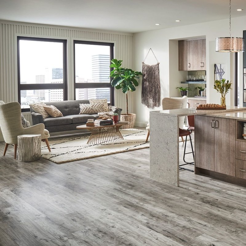 Open space living room with brown laminate floor from Flooring Xpress Enterprise and Design in Chicago, IL