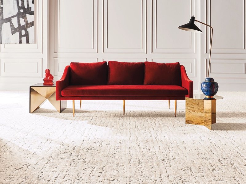 Red sofa on beige carpet from Flooring Xpress Enterprise and Design in Chicago, IL