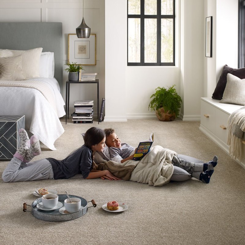 Kids reading on soft brown carpet from Flooring Xpress Enterprise and Design in Chicago, IL